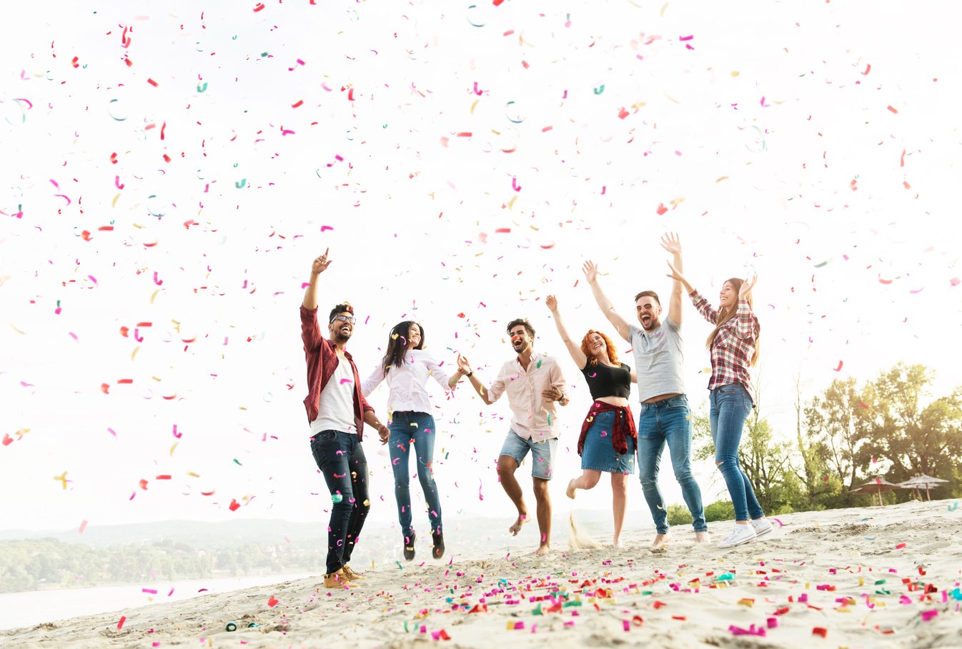 Group of young people celebrating at the beach